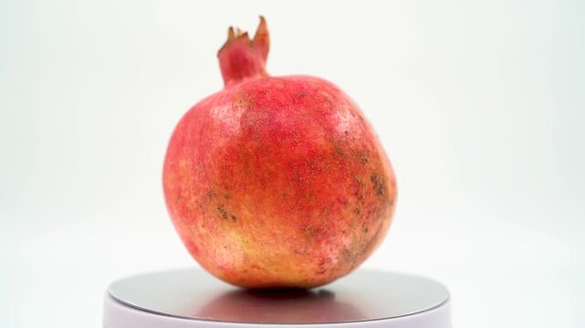 Close up of pomegranate on white background isolated