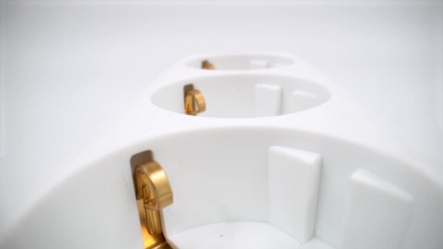 Close up of triple plug socket isolated on white background