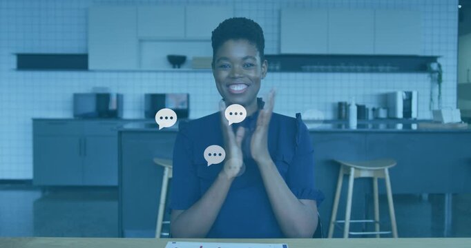 Woman clapping in kitchen, generating chat bubbles for marketing tapping tablet reviewing replies