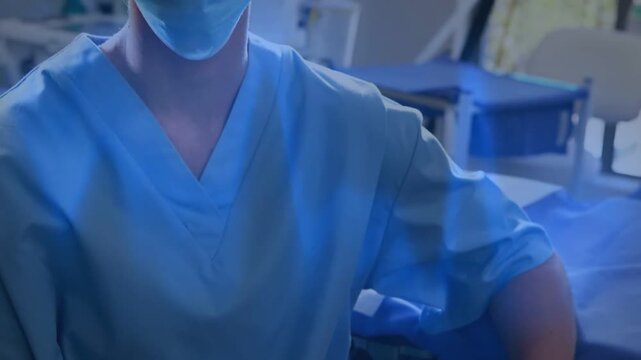 Camera pulling back, showing masked nurse resting gloved hand on cart, preparing medical procedure