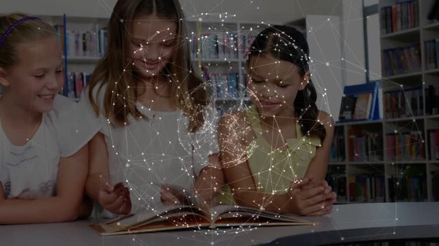 Vertical video: Third girl joining, girls reading and pointing while globe over book in library