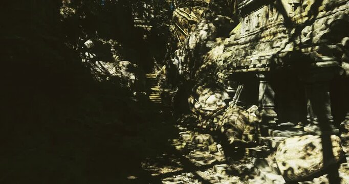 sunlit rocky canyon path with shadows, secluded ravine landscape, scattered low vegetation, rugged boulders and steep cliffs, narrow sunlit slit cutting dark