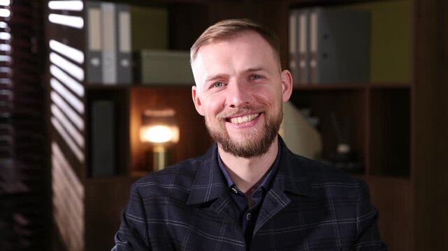 Smiling man wearing suit posing in office