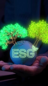 Businessman shows earth global with ESG icon and virtual tree. Net zero greenhouse gas emissions target. Climate neutral long term strategy. Ecological, renewable energy and save environment concept.