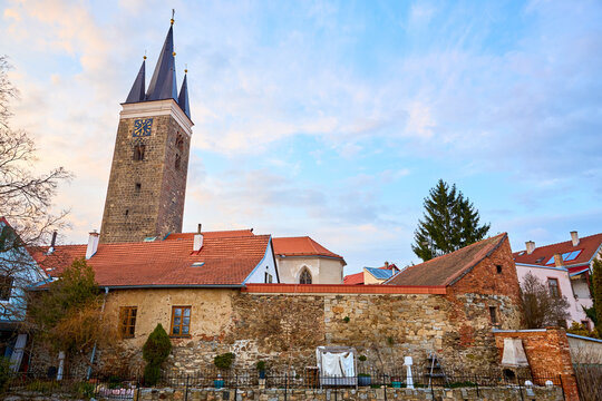 Historic church and rustic stone wall in charming european town