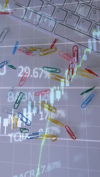 Vertical video: Market feed updating moving clips over keys while candles plotting trend shifts
