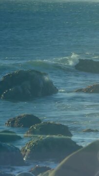 Vertical video: Teal overlay sweeping, camera shifting right, waves breaking, HUD mapping shoreline