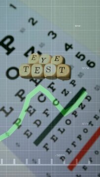 Vertical video: Eye chart letter cubes sliding down as green graph animating over grid for vision