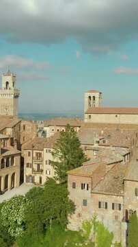 Aerial vertical summer view of Montepulciano town, located on top of a limestone ridge surrounded by vineyards. Vino Nobile territory, known worldwide for wine tours. Famous movie filming background.