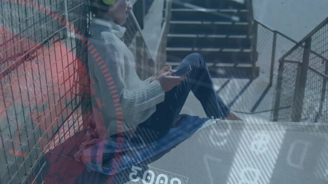 Vertical video: Girl sitting on steps tapping phone showing techHUD donning green headset listening