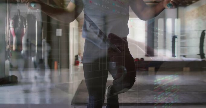 Man swinging rope, starting quick footwork, revealing torso, creating layered gym glow for cardio