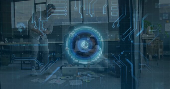 Vertical video: Team on floor around laptop papers, man tapping, HUD appearing showing tech data