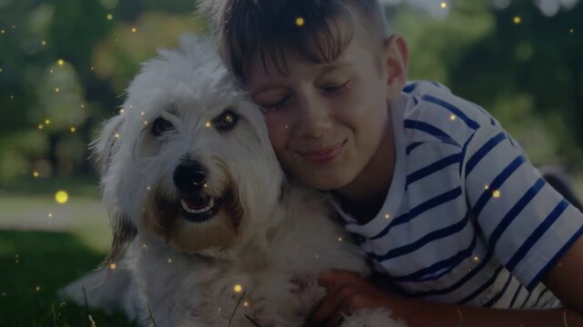 Boy starting head shift toward dog, pressing chest, expressing love, golden particles drifting