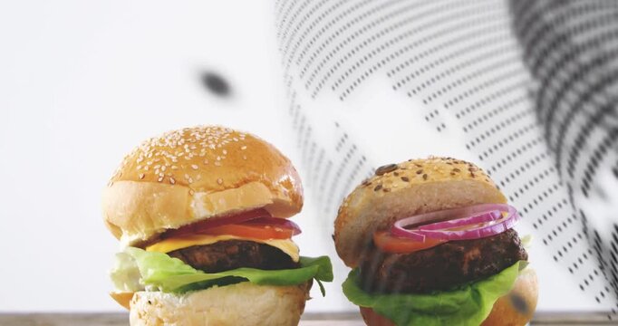 Halftone graphic sweeping across frame and revealing two sliders on wooden board for food marketing