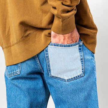 Man put his hand into back pocket of jeans transparent png