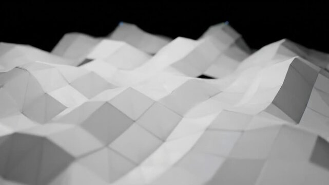 Abstract white paper landform with geometric mountain range design against a black background