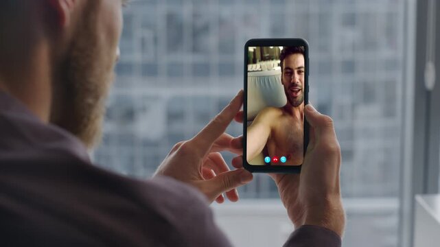 Freelancer talking videocall smartphone at windowsill closeup. Man chatting tab