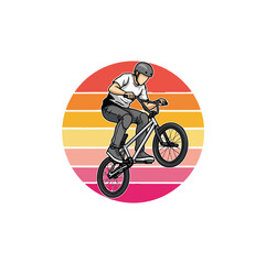 Fototapeta premium Bmx rider performing stunt against sunset background
