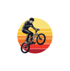 Fototapeta premium Bmx rider silhouette performing stunt against sunset background