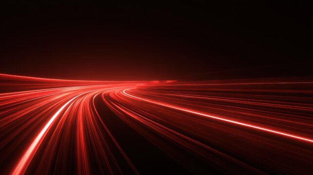 Abstract red light trails and motion blur create a fast urban night landscape with speeding car traffic on a dark highway asphalt road