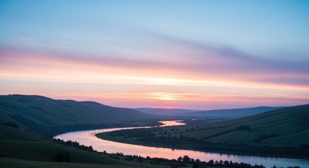 Fototapeta premium A serene sunset over a river with rolling hills in the background, with a vibrant pink and purple sky and a calm, reflective river.