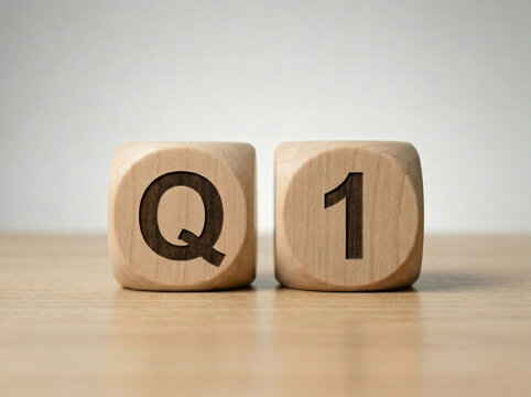 q1 text on wooden blocks placed on clean surface with minimal background for business and financial quarter concept