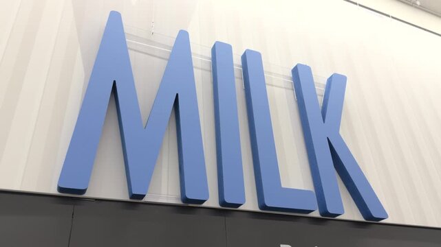 Large MILK wall sign at grocery store 4k