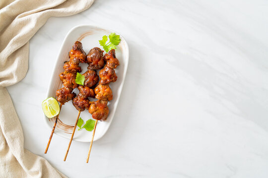 grilled chicken gizzard skewer with herbs and spices