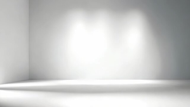 Minimalist empty white room with soft spotlight illumination on a clean wall, creating a modern and serene atmosphere. Perfect for product display, presentations, or creative backgrounds