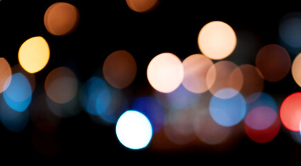 Fototapeta premium Abstract Night City Light Bokeh Background with Blurred Out of Focus Circles