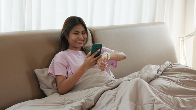 AI smart IOT watch wrist wear collect ECG heart rate data sleep track record health care device digital internet of things app. Asia people woman urban tech life home future living wake get up morning