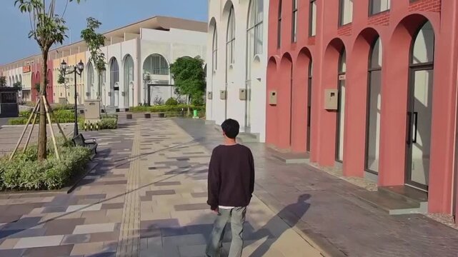 young man walking in the city