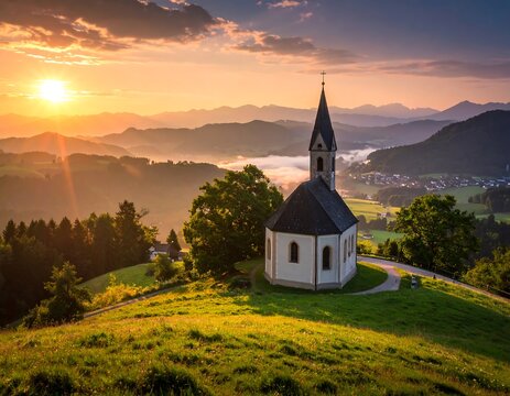 Picturesque church on hilltop at sunrise surrounded by rolling hills and valleys