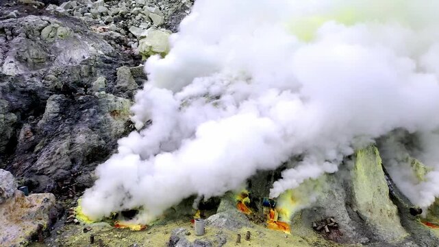 Breathtaking Close Up Drone Footage of Heavy White Clouds And Toxic Fumes. Billowing Out From Active Crater of Kawah Ijen in East Java Indonesia. Aerial View Dramatic And Mysterious Atmosphere 4k