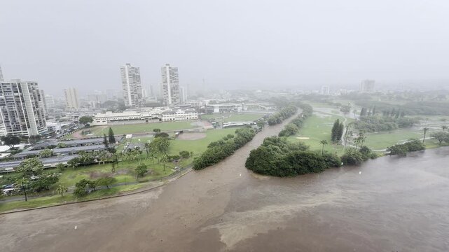 March 2026 Kona storm. Ala Wai Canal Floods after heavy rain. Waikiki, City of Honolulu, Ohau, Hawaii winter. Koʻolau Range (shield volcano). Golf Course.