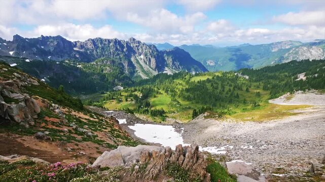Footage capturing the stunning alpine scenery and meadows of the popular Spray Park Trail in Mount Rainier National Park. This moderately strenuous hike offers incredible views of the Cascade Mountain