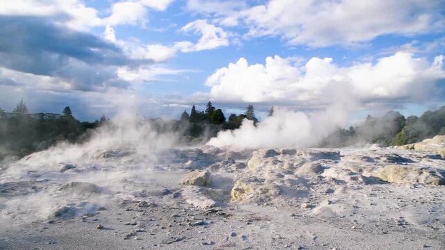 Scenic view of Te Puia geothermal valley in Rotorua with volcanic landscape and clear sky