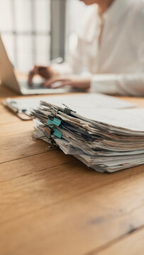 Business person working laptop and documents	