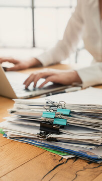 Business person working laptop and documents	