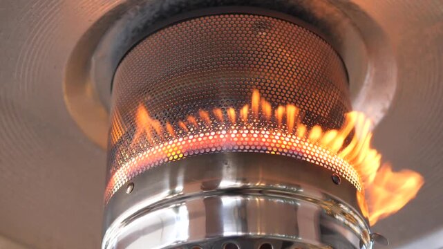 Close up video of flames from gas heater dancing in captivating and mesmerizing motion.