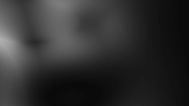 Abstract black and white image with blurred light areas. Suitable for backgrounds, website design, and artistic projects. Ideal for modern design concepts.