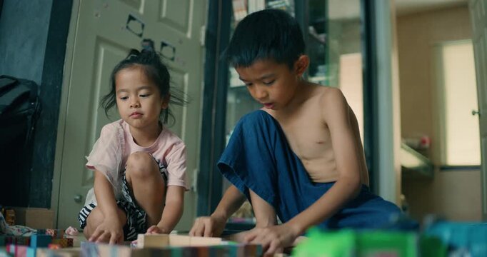 Kids boy and girl enjoy play toy in cozy room enjoy together kids education learnning