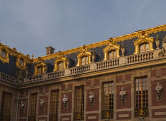Fototapeta premium Ornate Gilded Roof and Baroque Architecture at Palace of Versailles, France