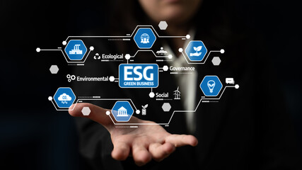 Naklejka premium A professional individual showcases a digital graphic symbolizing ESG principles, highlighting important aspects of sustainability and responsible business practices. Tessel