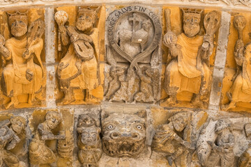 Obraz premium Ancient Romanesque stone carvings on the portal of Oloron Cathedral, France