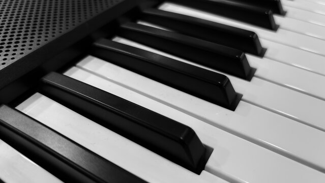 Close-Up of Black and White Piano Keys with Intricate Details and Textures