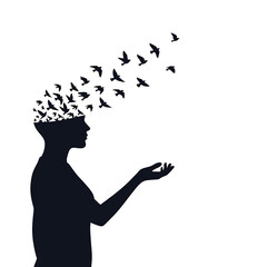 Silhouette of man with birds escaping. © Moran