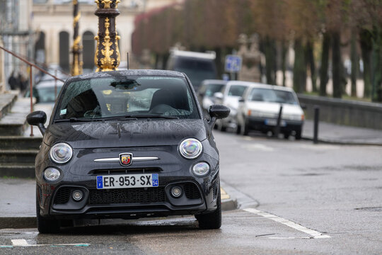Nancy, France - January 30th 2021 : View on a black Abarth 595 with water drops parked on a street.