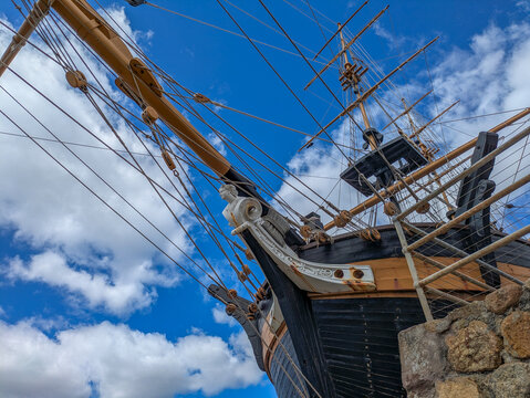 Historic tall ship brig bow with figurehead masts and rigging against blue sky in Albany Australia