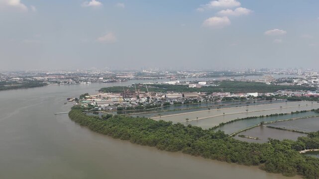 Aerial view of chao phraya river delta and bangkok skyline